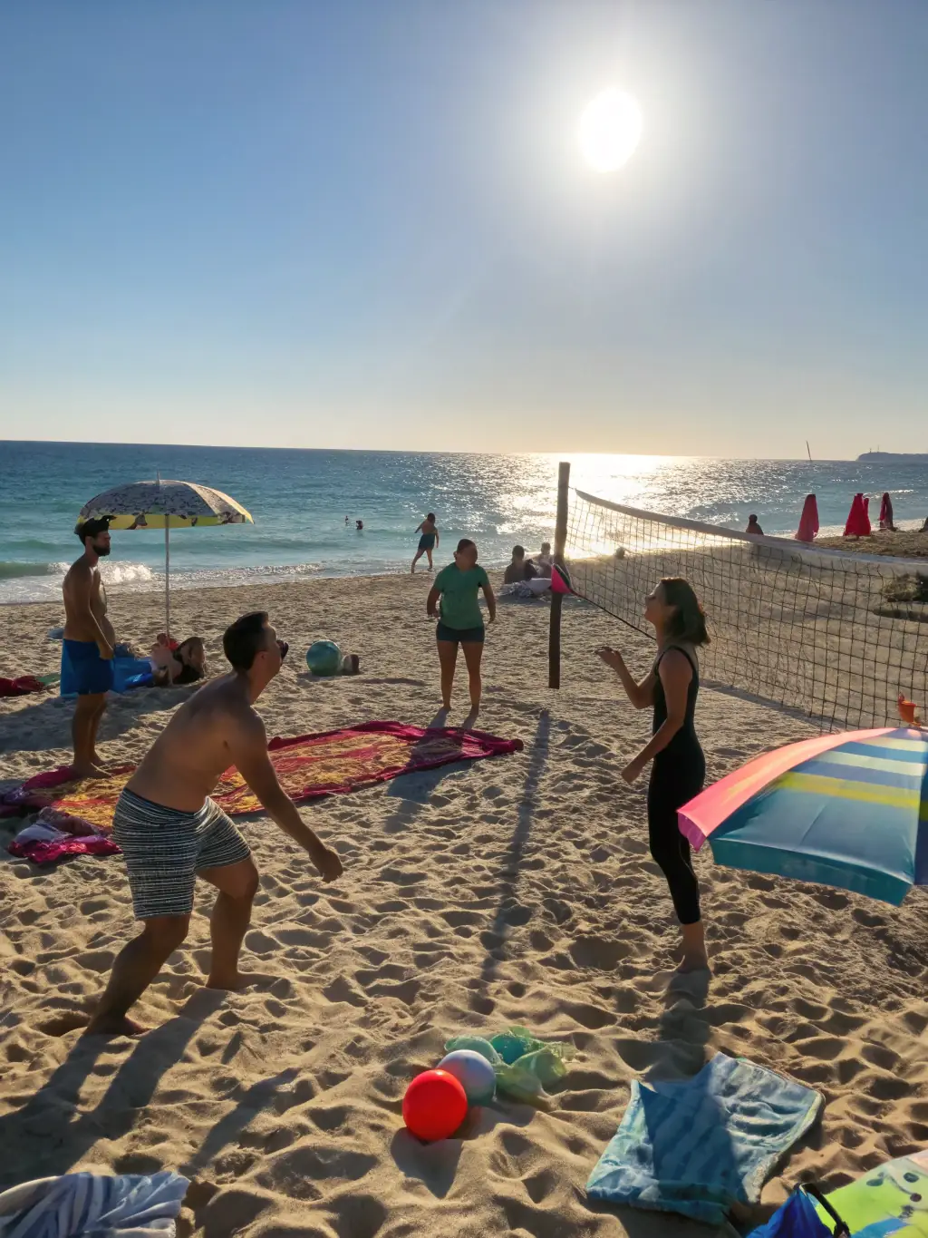 A group of adults engaged in a friendly game of volleyball on a sunny beach, emphasizing social interaction and active lifestyles.